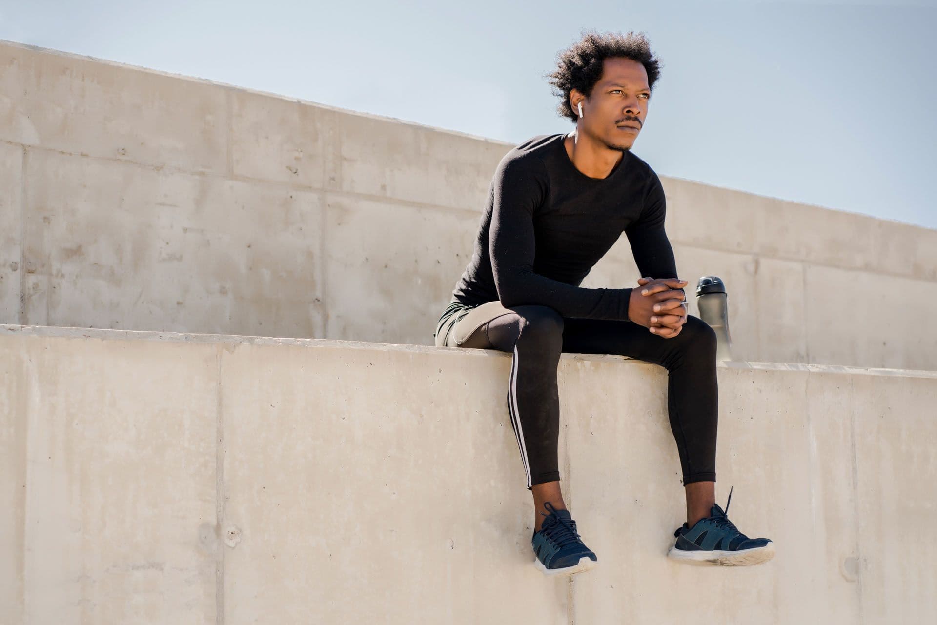 IV-Therapy-man-sitting-wall-workout-attire